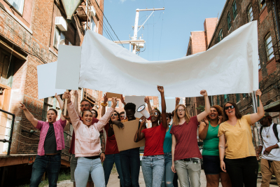 group of people raising a white flag